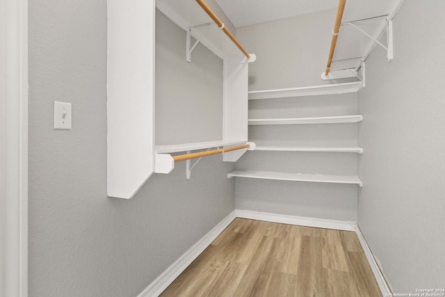 walk in closet featuring wood-type flooring