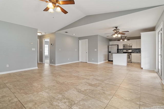 unfurnished living room featuring lofted ceiling and ceiling fan