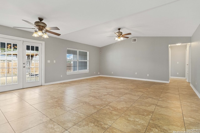 unfurnished room featuring lofted ceiling, light tile patterned floors, french doors, and ceiling fan