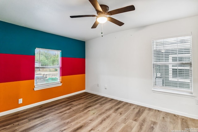 empty room featuring ceiling fan and wood-type flooring