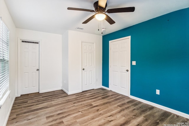 unfurnished bedroom with hardwood / wood-style flooring and ceiling fan