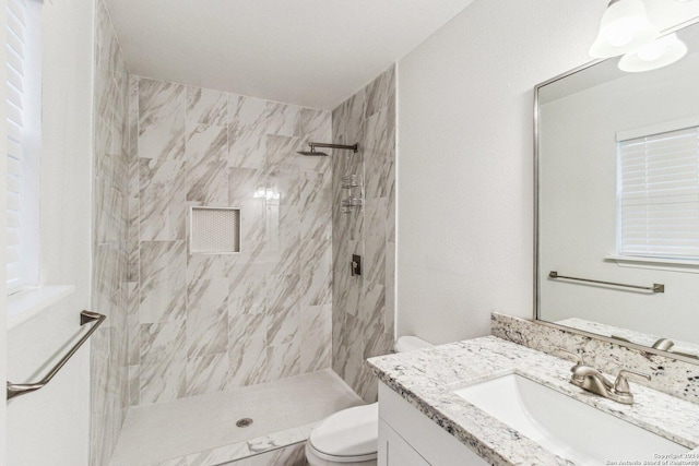 1102 Onslow, San Antonio, TX 78202 - bathroom with toilet, vanity, and a tile shower