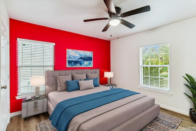 bedroom featuring dark hardwood / wood-style flooring and ceiling fan