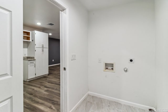 laundry area with light hardwood / wood-style flooring, washer hookup, hookup for a gas dryer, and hookup for an electric dryer