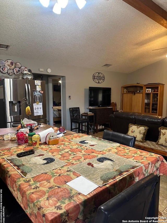 dining area featuring a textured ceiling