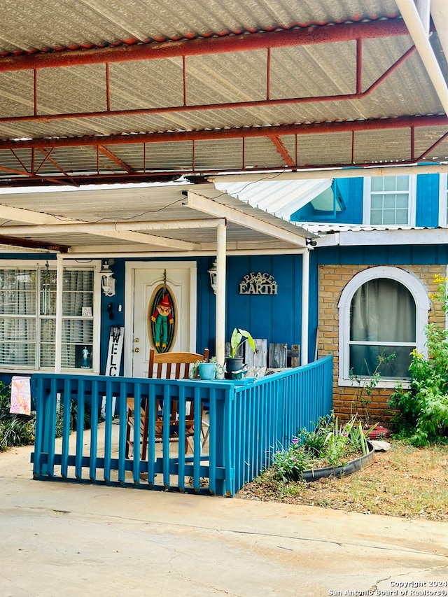 doorway to property with a porch