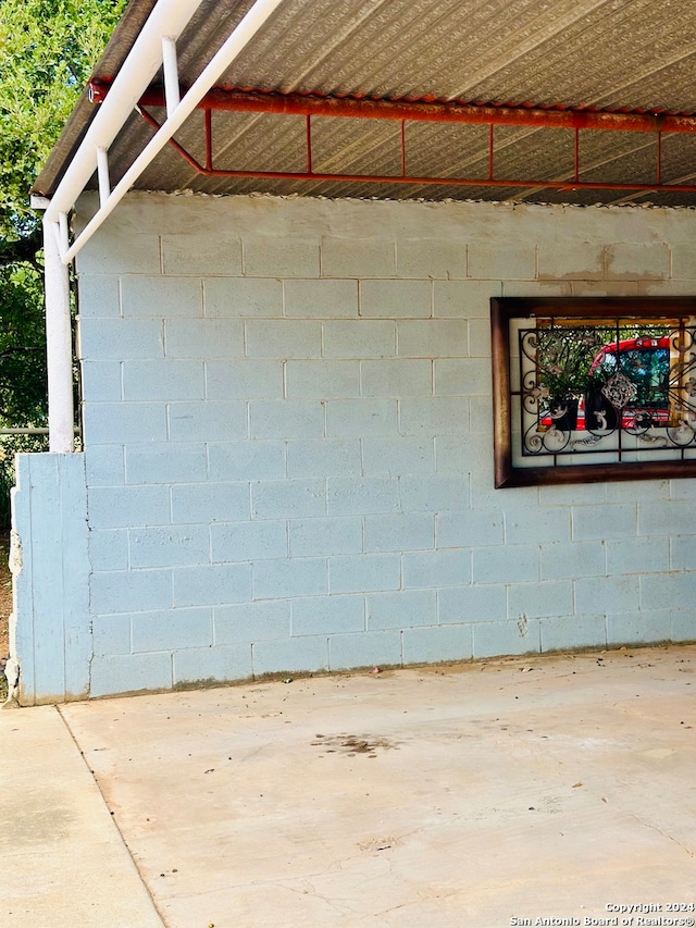 exterior details featuring concrete flooring