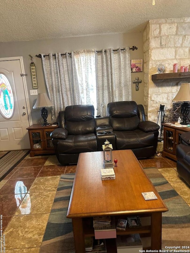 living room with a textured ceiling