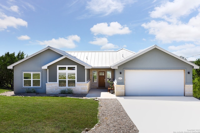 view of front of home with a garage and a front yard