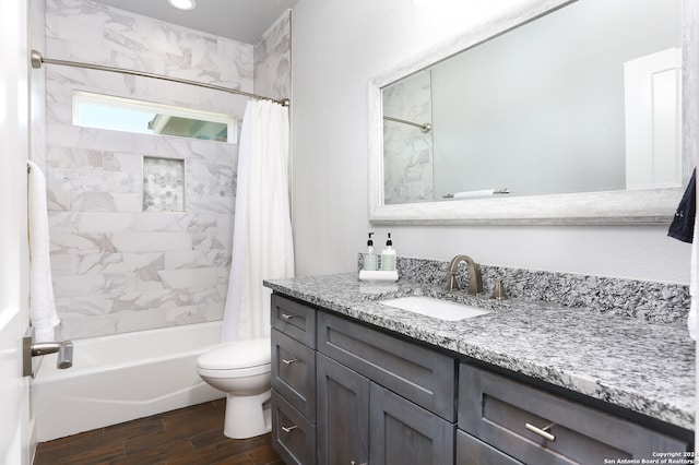 full bathroom with toilet, shower / tub combo, vanity, and hardwood / wood-style flooring