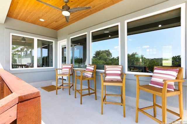 view of patio / terrace featuring ceiling fan and a balcony