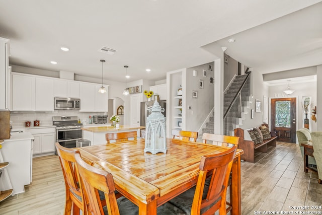 dining room featuring light hardwood / wood-style floors