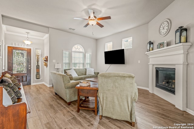 living room featuring hardwood / wood-style flooring and ceiling fan