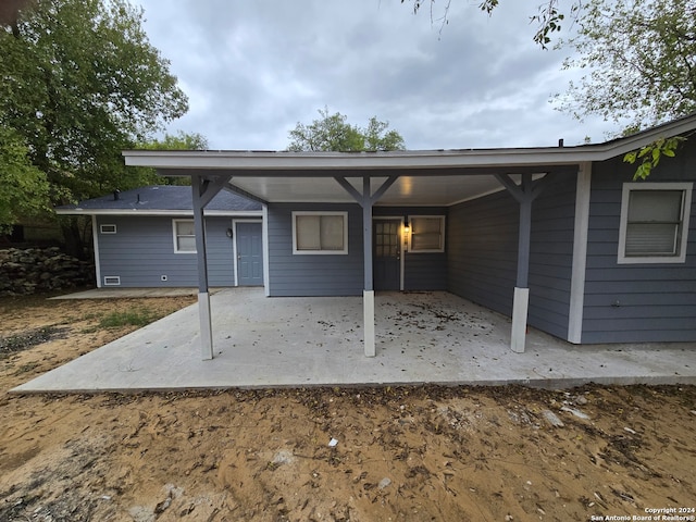 back of property featuring a patio