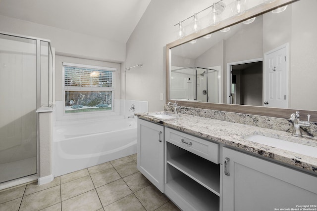 bathroom with tile patterned flooring, plus walk in shower, vanity, and vaulted ceiling