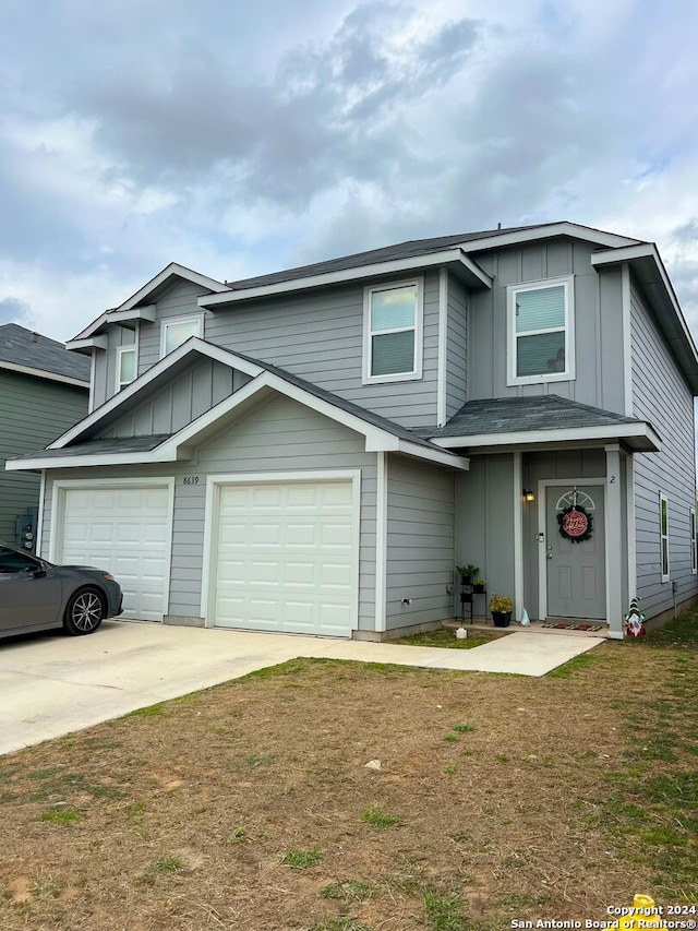 view of front facade with a front lawn and a garage