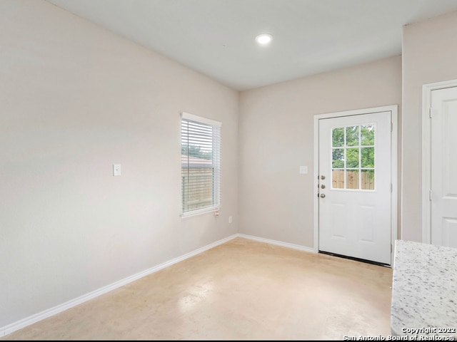 interior space featuring light carpet