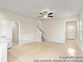 unfurnished room with ceiling fan