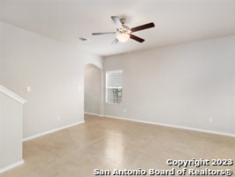 unfurnished room with ceiling fan