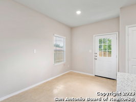 spare room with light colored carpet