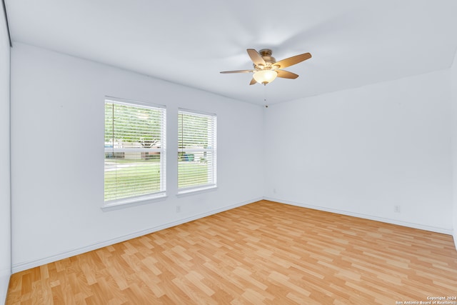 spare room with ceiling fan and light hardwood / wood-style floors