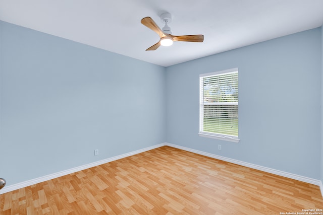 spare room with ceiling fan and light hardwood / wood-style floors