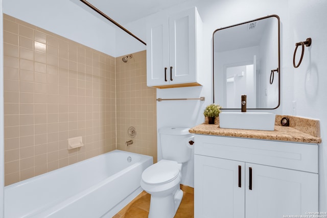 full bathroom with tile patterned flooring, vanity, toilet, and tiled shower / bath