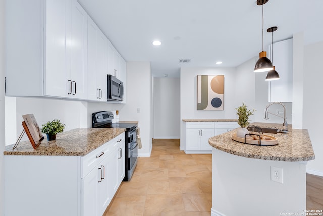 kitchen featuring kitchen peninsula, light stone counters, stainless steel appliances, white cabinetry, and hanging light fixtures