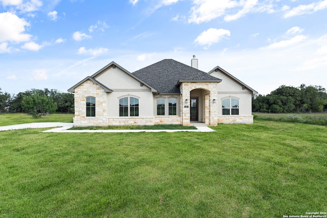 french country home with a front yard