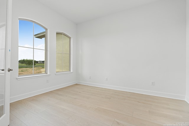 empty room with light wood-type flooring