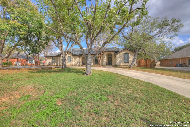 single story home featuring a front yard