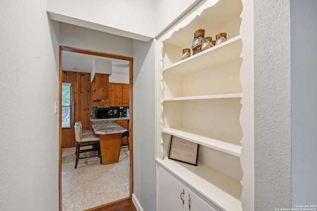 interior space featuring wood walls