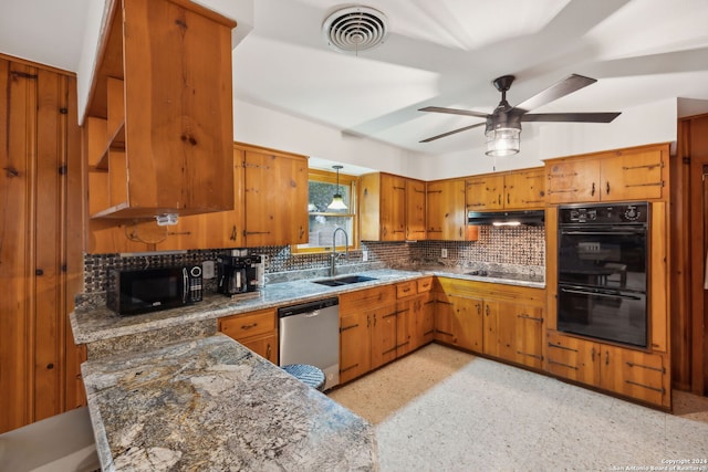 kitchen featuring decorative backsplash, dark stone counters, ceiling fan, sink, and black appliances