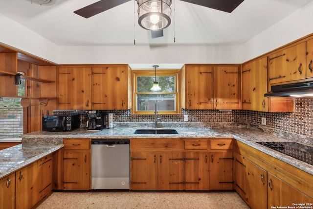 kitchen featuring tasteful backsplash, stainless steel dishwasher, sink, pendant lighting, and black stovetop