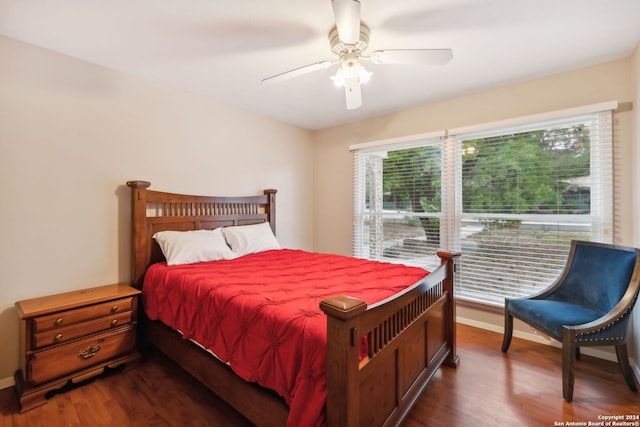 bedroom featuring ceiling fan and dark hardwood / wood-style floors