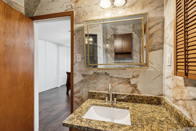 bathroom featuring vanity and wood-type flooring