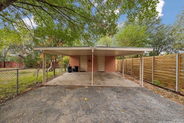 view of parking / parking lot with a carport