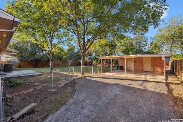 view of yard featuring central air condition unit and a patio area