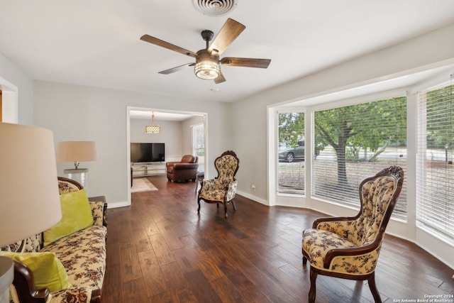 sitting room with ceiling fan and dark hardwood / wood-style floors