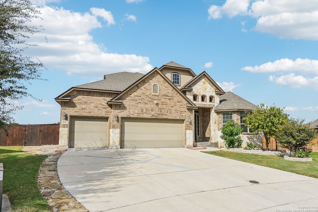 view of front facade featuring a garage and a front yard