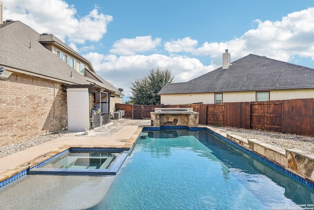 view of pool with cooling unit and an in ground hot tub