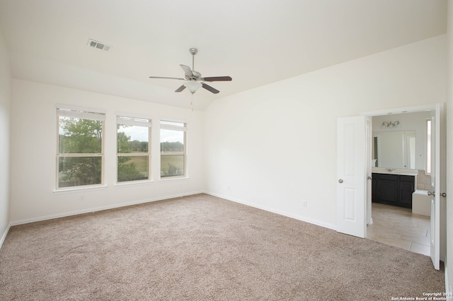 unfurnished room with ceiling fan and light carpet