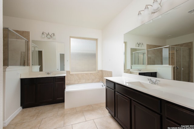 bathroom featuring vanity, tile patterned floors, and plus walk in shower