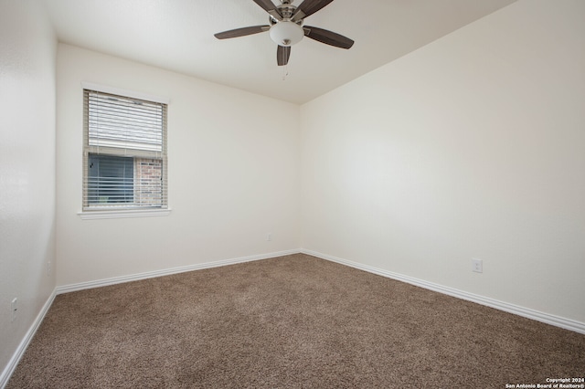 spare room featuring carpet flooring and ceiling fan