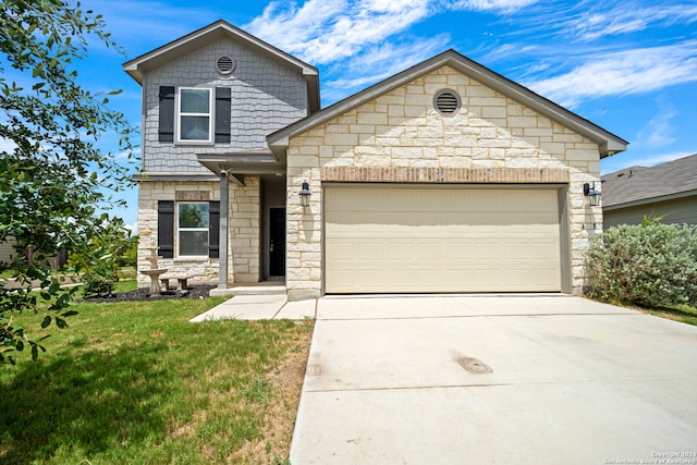 view of front facade featuring a garage and a front yard