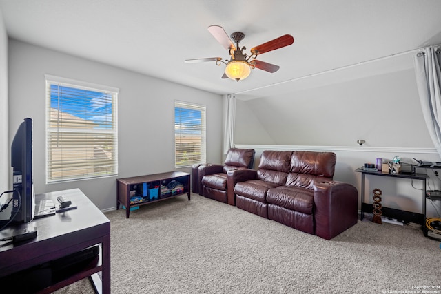 carpeted living room with ceiling fan