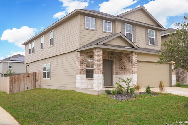 view of front of house featuring a garage and a front lawn