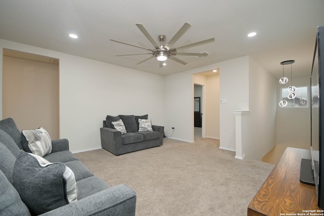 carpeted living room featuring ceiling fan