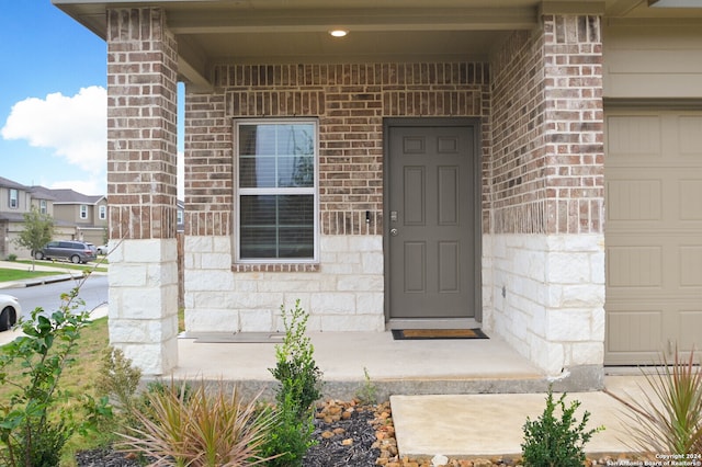 property entrance featuring a garage