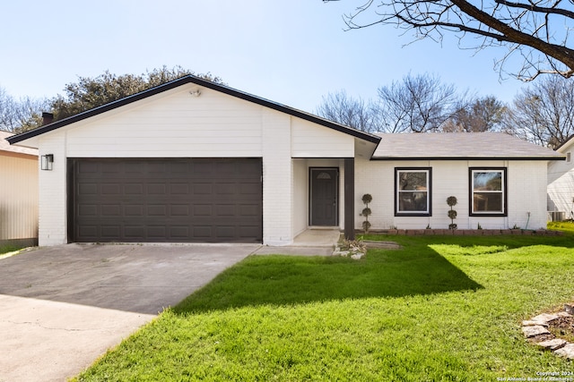 ranch-style home with a front lawn and a garage